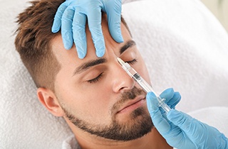 A man getting BOTOX between his eyebrows