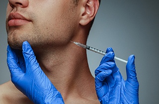 A man getting BOTOX for TMJ treatment