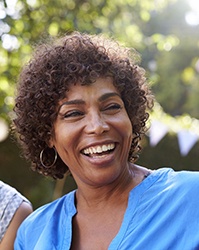 Group of women with dental implants in Boston laughing together outside