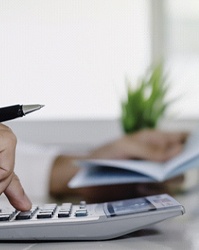 Man calculating cost of veneers in Boston