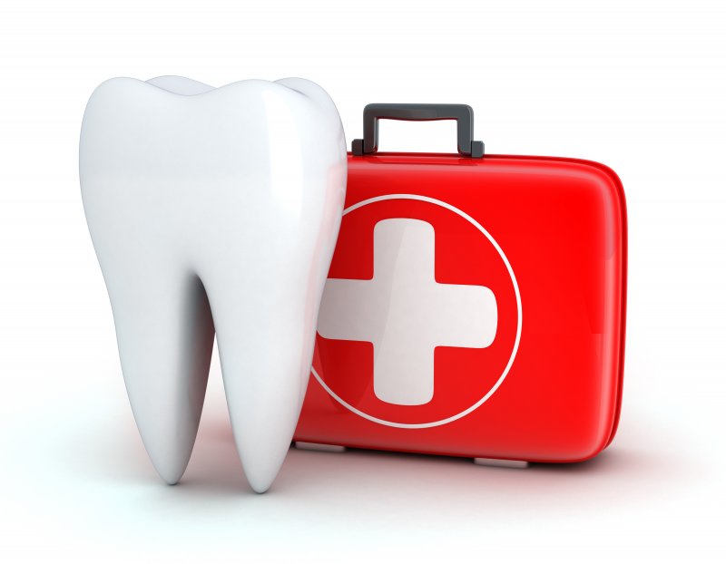 Dental emergency kit next to tooth