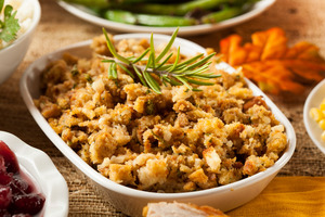 Thanksgiving stuffing with a garnish on a wooden table