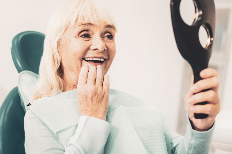 smiling person wearing dentures