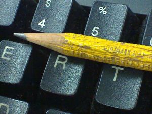 Chewed up pencil on computer keyboard