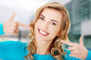 Woman with pretty white teeth smiling.